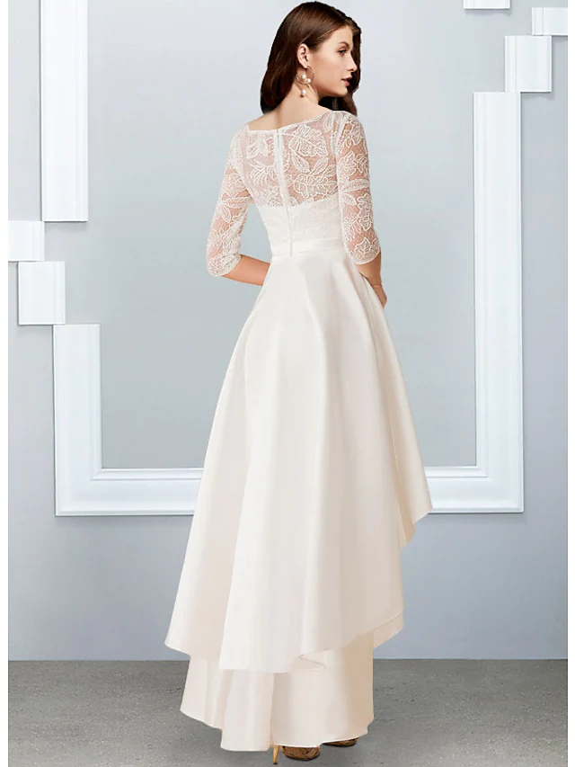 Back view of an A-Line chiffon lace wedding gown with asymmetrical hem.
