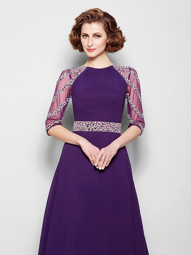 Full view of the Mother of the Bride dress with crystal embellishments.