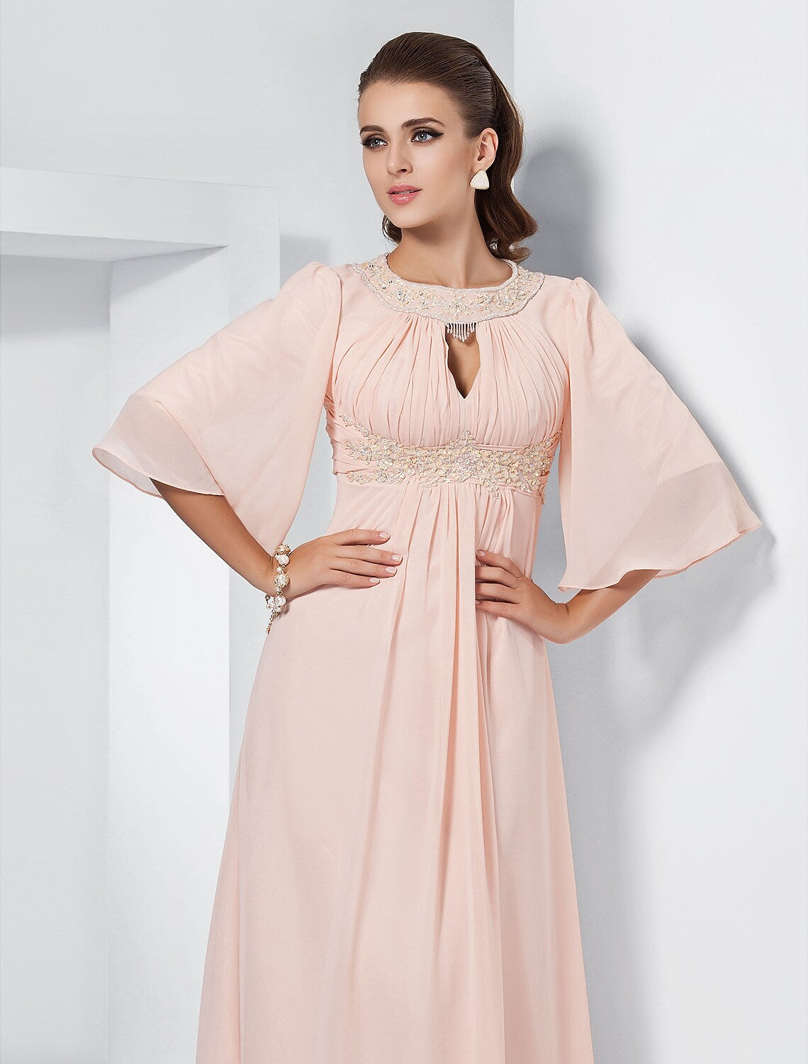 Back view of the A-line special occasion dress with sweep train.
