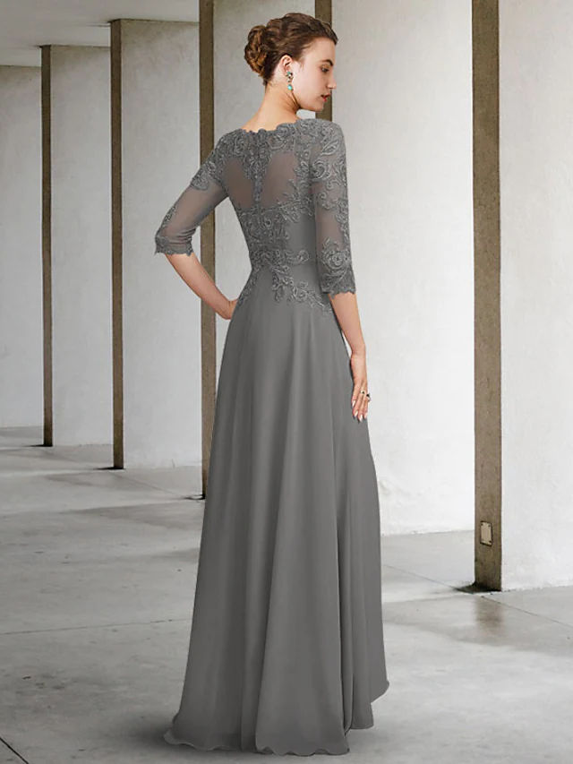 Close-up of the chiffon and lace details on the A-line mother of the bride dress.