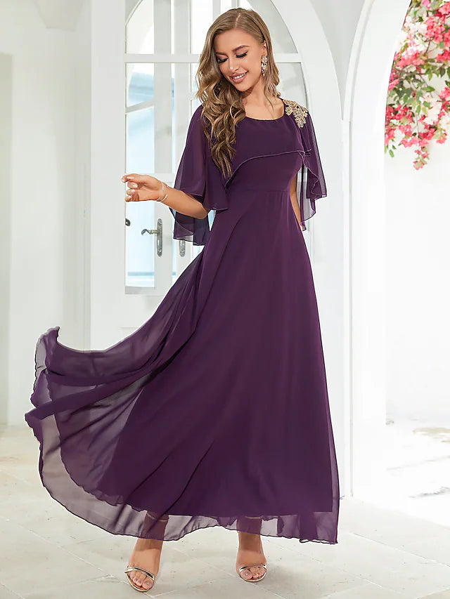 Back view of the floor-length ruffled chiffon dress.