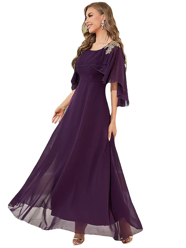 Side profile of the A-line wedding guest dress.