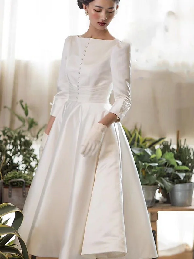 Back view of A-Line satin tea length wedding dress with buttons.