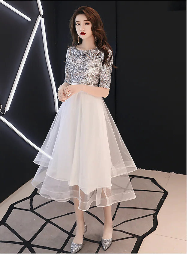 White A-Line cocktail prom dress with jewel neck and half sleeves, featuring a sparkling sequin tier.