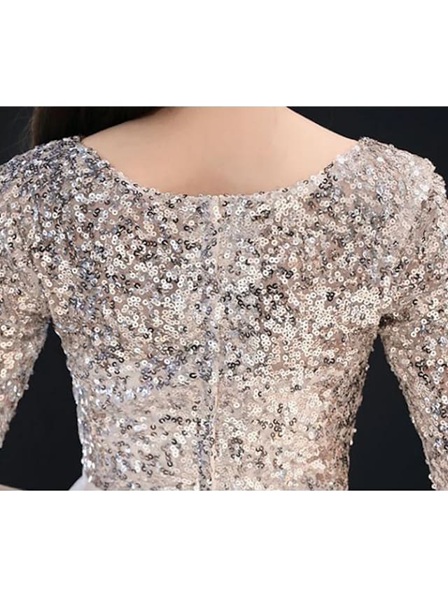 Back view of the elegant white A-Line dress, highlighting the flow of the tea-length skirt.