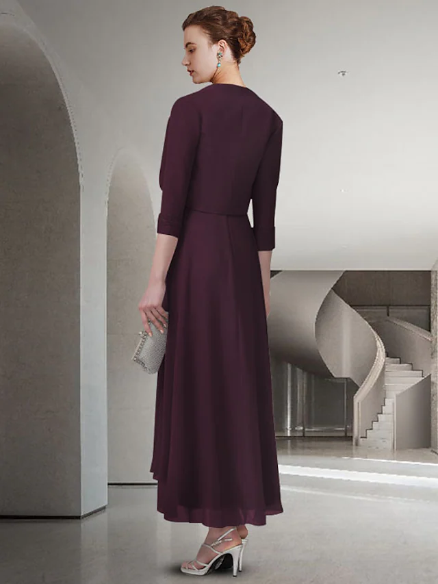 Back view of the A-line Mother of the Bride dress, showcasing pleats and tea length.