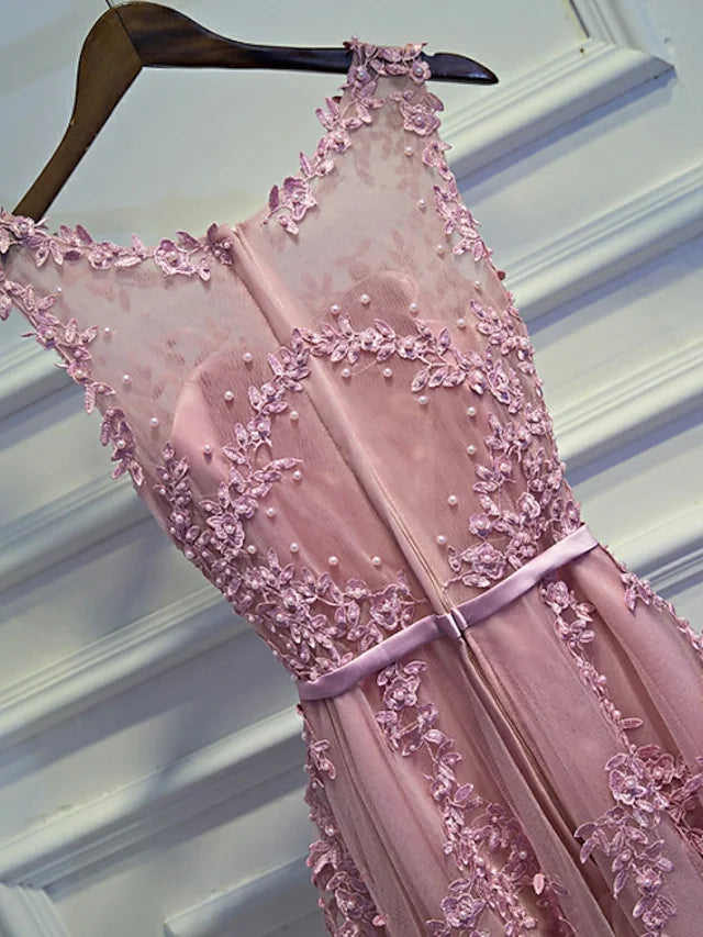 Back view of a sleeveless A-Line mini dress with intricate beading.