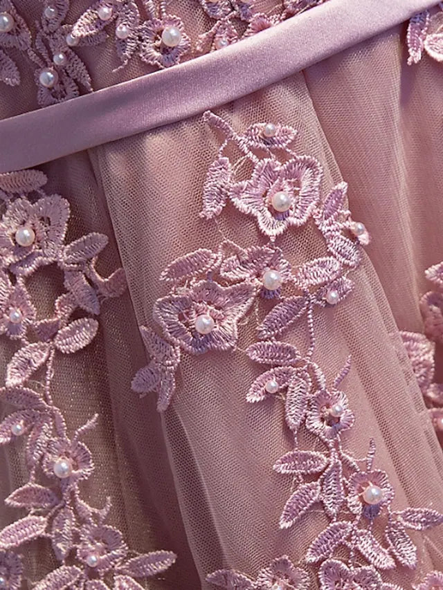 Side profile of a formal A-Line dress featuring lace details.