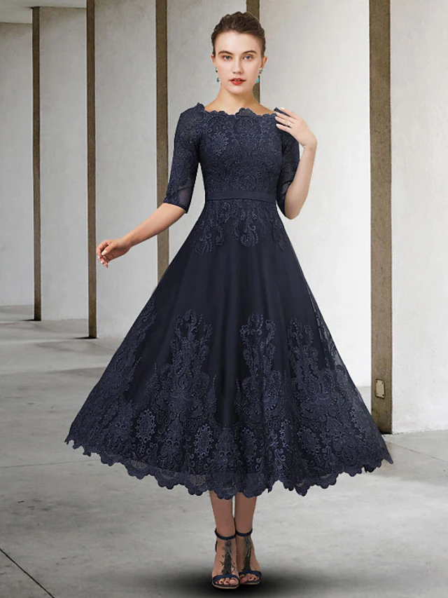 Elegant A-Line Mother of the Bride dress with jewel neck and half sleeves.