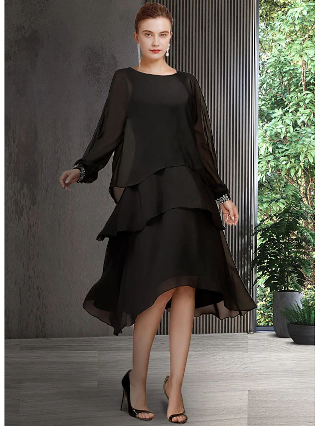 Elegant A-line mother of the bride dress with jewel neck and long sleeves.