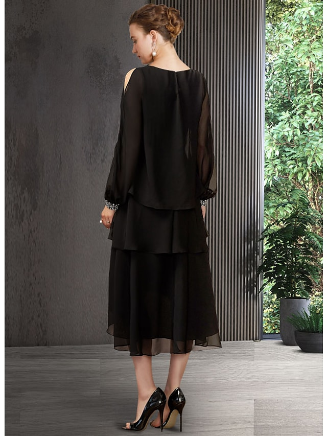 Side view of the A-line chiffon dress, highlighting the asymmetrical design and sequin tier.