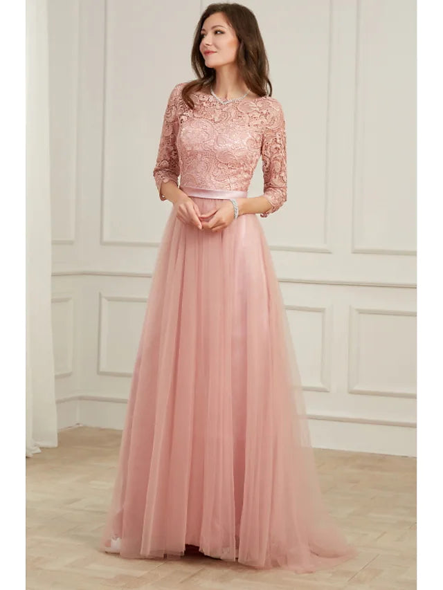 Close-up of delicate lace appliques on a long sleeve evening dress.