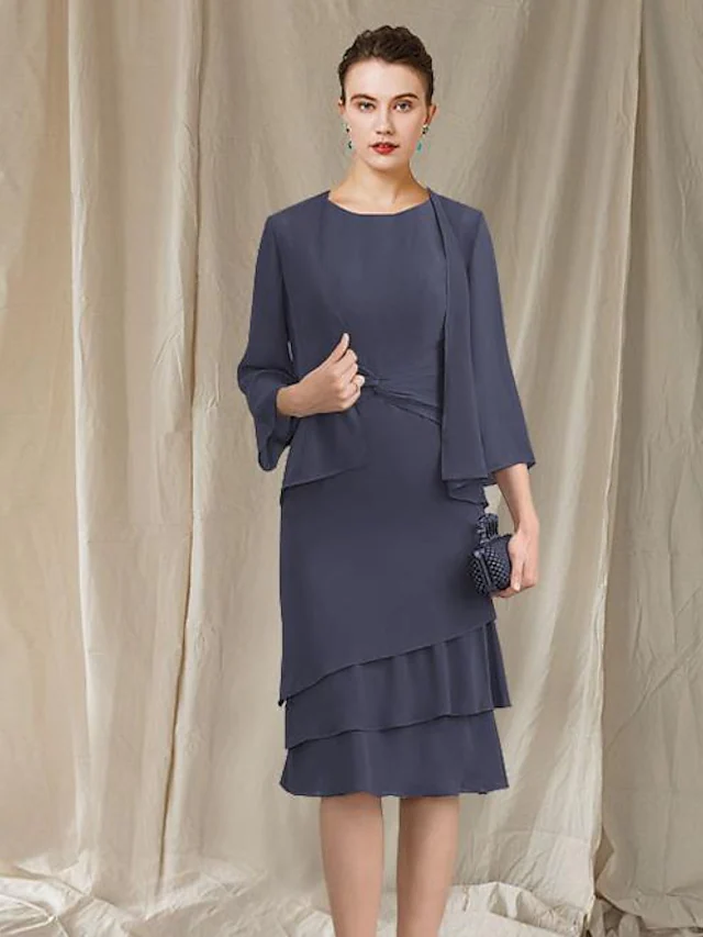 Elegant A-line mother of the bride dress with jewel neck and ruched ruffles.