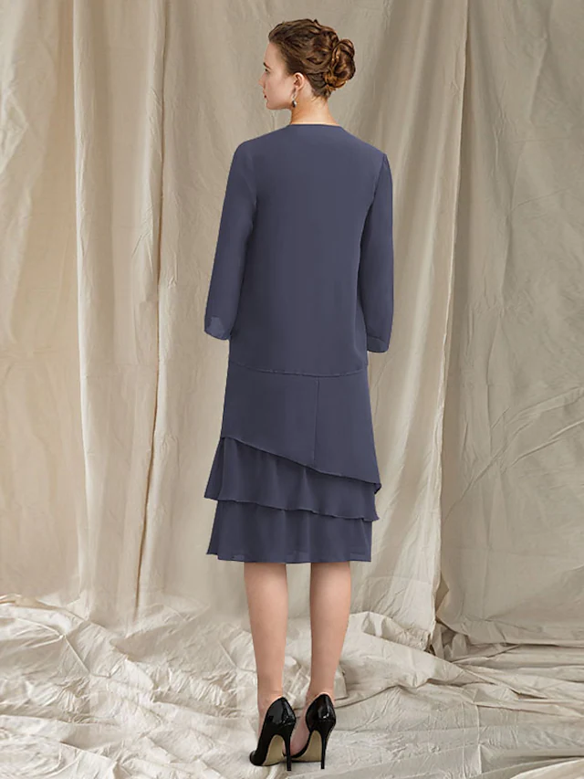 Back view of the two-piece chiffon knee-length dress, featuring an elegant wrap.