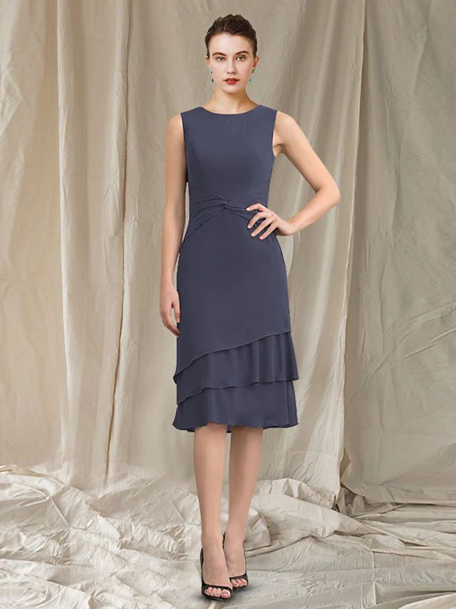 Side profile of the sleeveless A-line dress, showcasing its flowing chiffon and knee length.