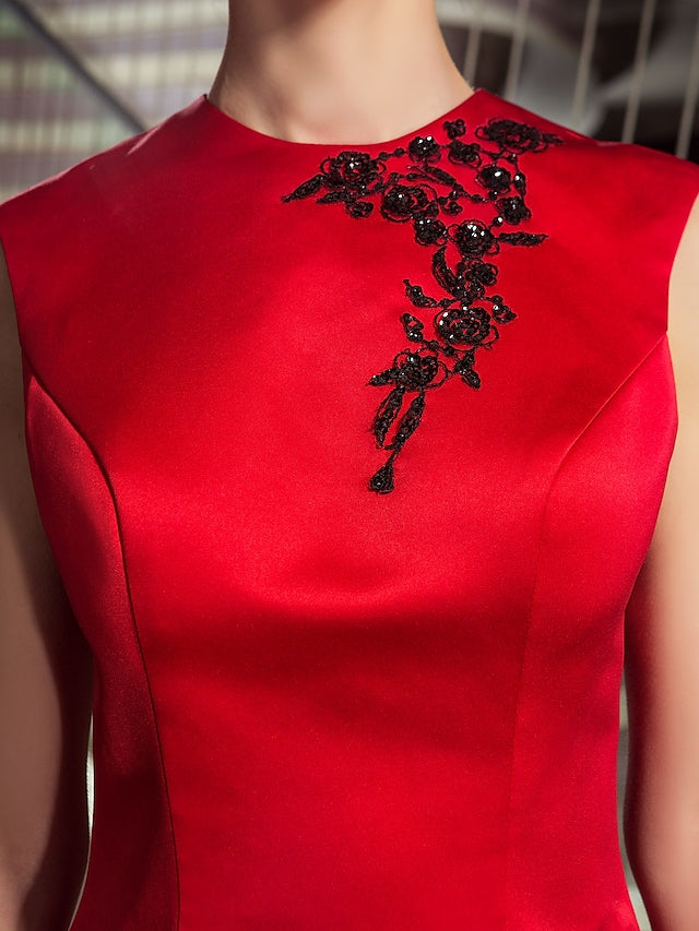 Model wearing the sleeveless A-line dress for a festive occasion.