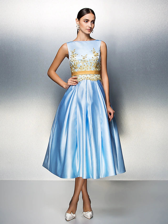 Back view of the A-line dress showing V-back and pleats.
