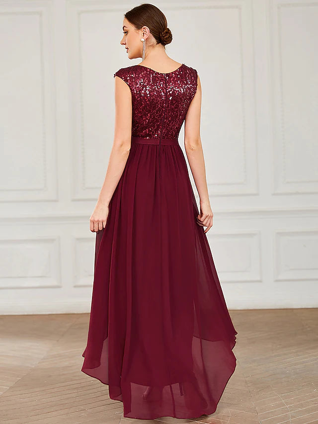 Close-up of the sequin details and draping on the cocktail dress.