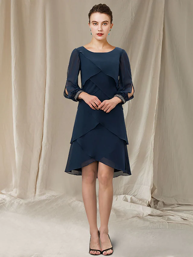 Woman wearing an elegant A-line jewel neck short sleeve chiffon mini dress with ruffles.