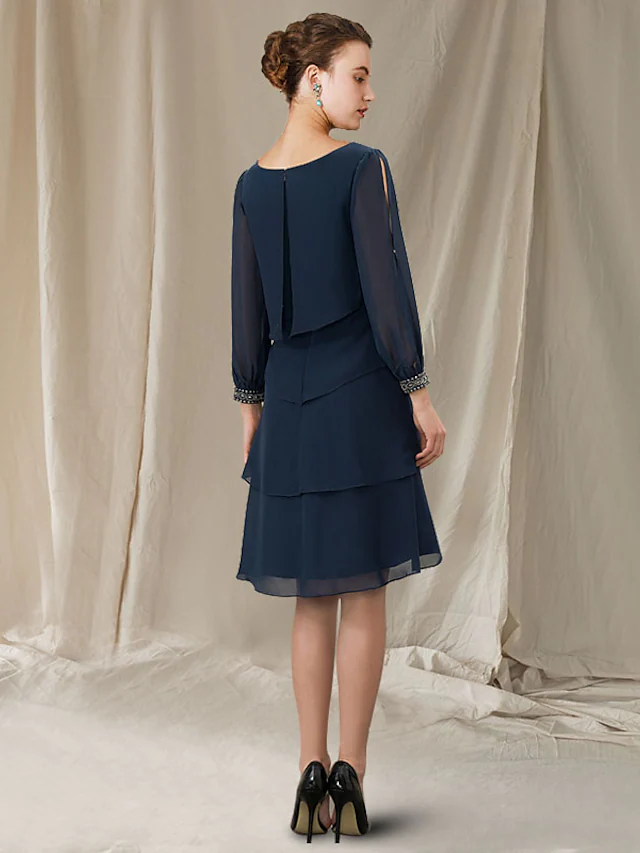 Back view of the elegant short sleeve A-line dress, showing the jewel neckline.