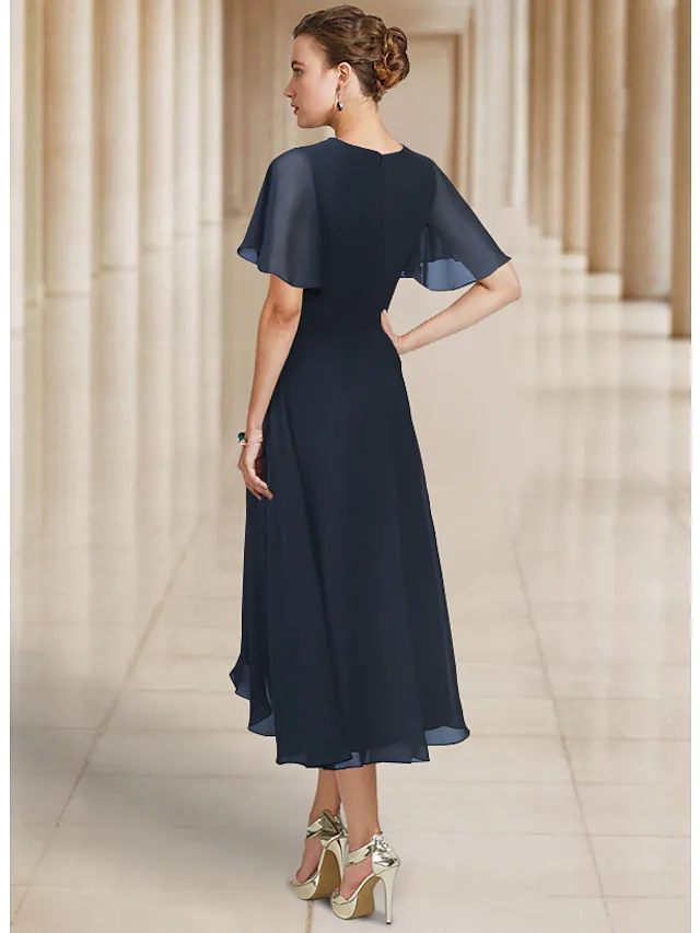 Side view of the A-line chiffon Mother of the Bride dress, showcasing its elegant pleats and asymmetrical hem.