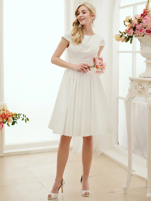 Back view of the A-line white wedding dress with sash.