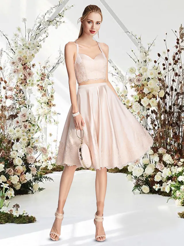 Side view of a sleeveless A-line mini dress, highlighting the lace and satin details.