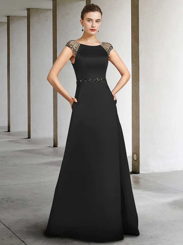 Elegant A-line mother of the bride dress in satin with jewel neck and sash ribbon.