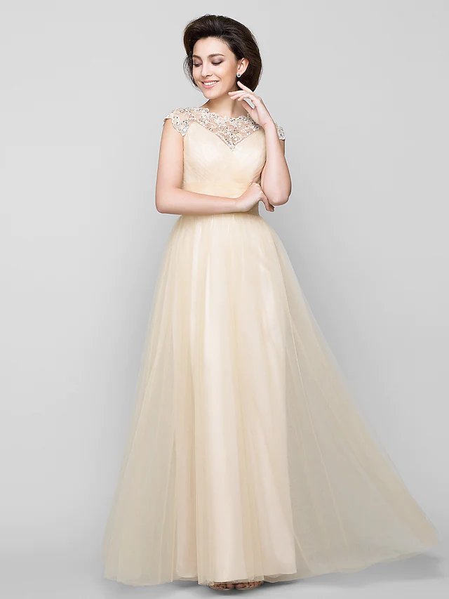 Elegant A-Line Mother of the Bride dress with jewel neck and tulle skirt.