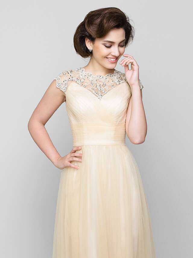 Full length view of the sophisticated A-Line formal gown.