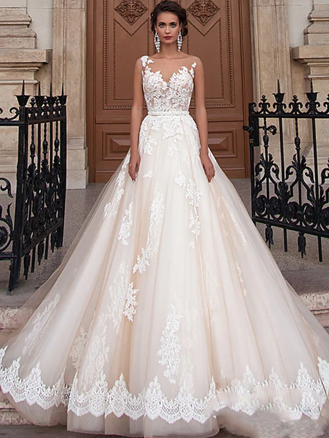 Elegant A-Line wedding dress with jewel neck, lace appliques, and court train.