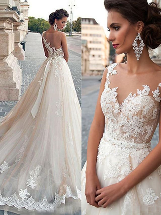 Back view of A-Line wedding dress showing illusion detail and court train.