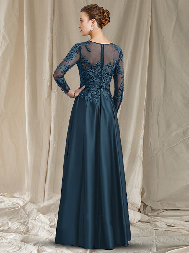 Back view of the A-line tea length Mother of the Bride dress with pleats and appliques.