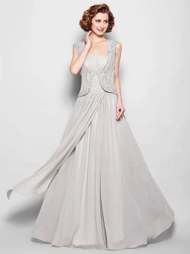 Close-up of the square neckline and intricate beading on the dress.