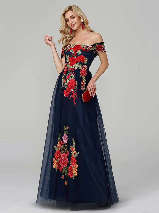 Close-up of floral lace appliques on the off-shoulder prom dress.