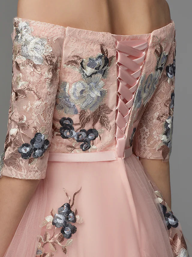 Side profile of a woman wearing the A-line off-shoulder prom dress.