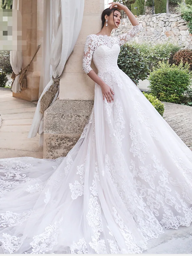 Elegant A-line off-shoulder lace wedding dress with a court train.