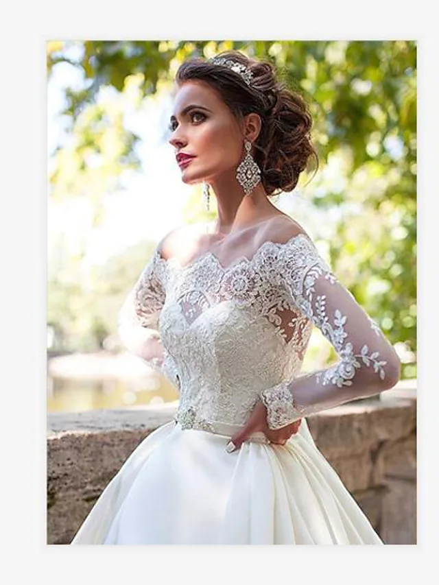 Side view of A-Line wedding dress showcasing the court train and flowing silhouette.