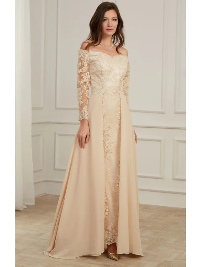 Side view of the floor-length gown highlighting appliques and fabric.