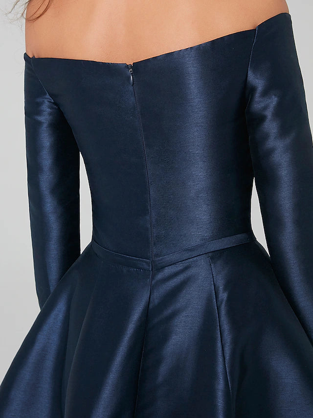 Full view of the satin knee-length wedding guest dress.