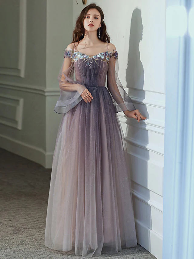 Back view of A-line off-shoulder long sleeve tulle dress.