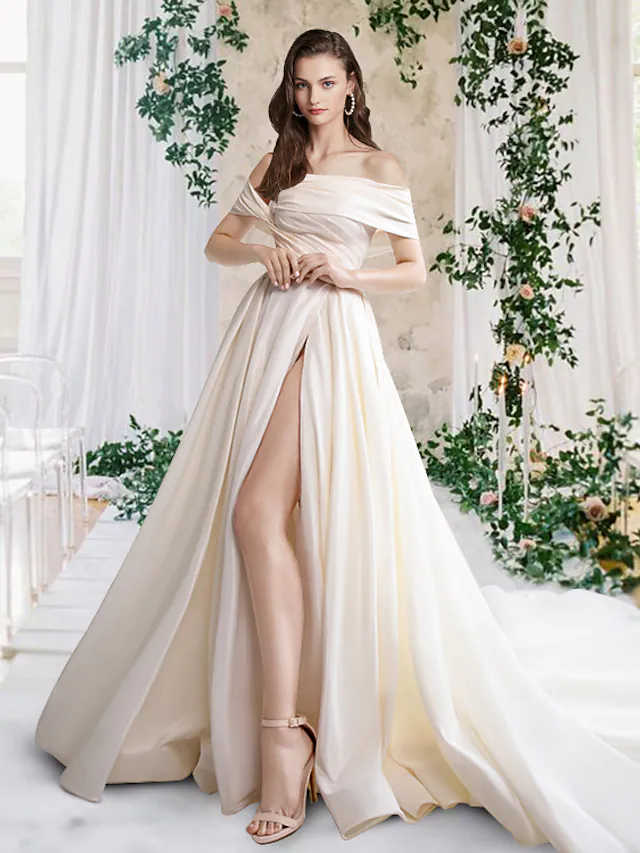 Elegant A-Line off-shoulder wedding dress with pleated taffeta fabric.