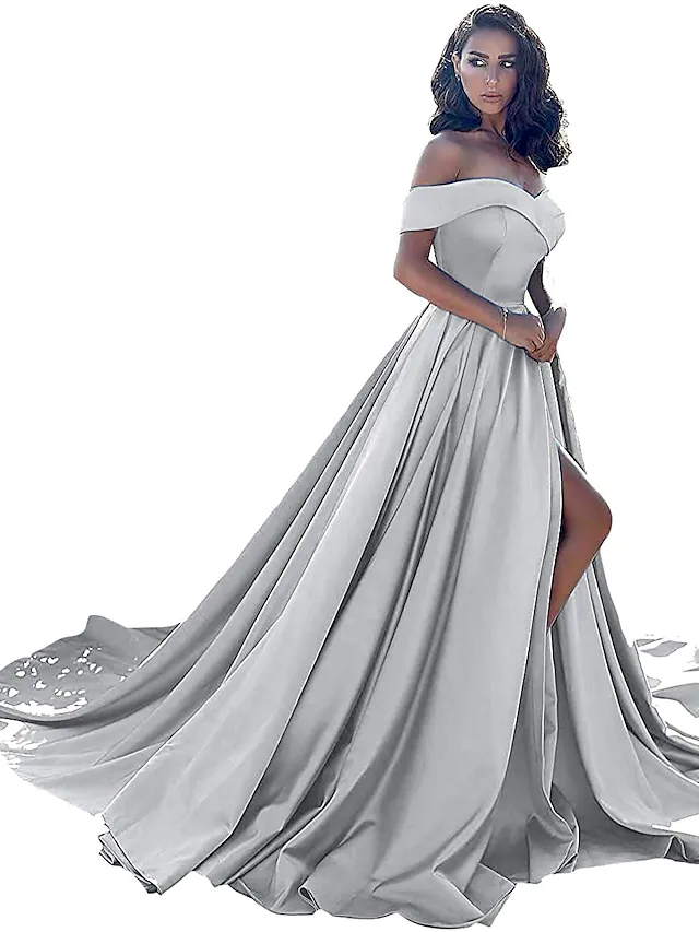 Side view of the blush pink formal dress highlighting the split front.