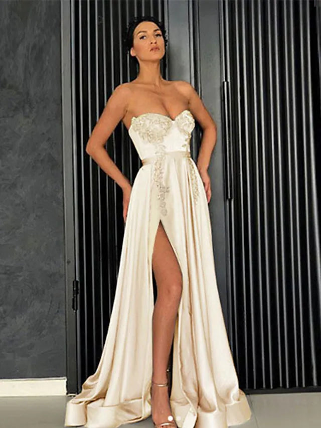 Elegant A-line off-shoulder satin prom dress with pleats and a slit.