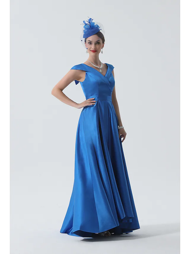 Close-up of the delicate pleats and satin fabric on the dress.