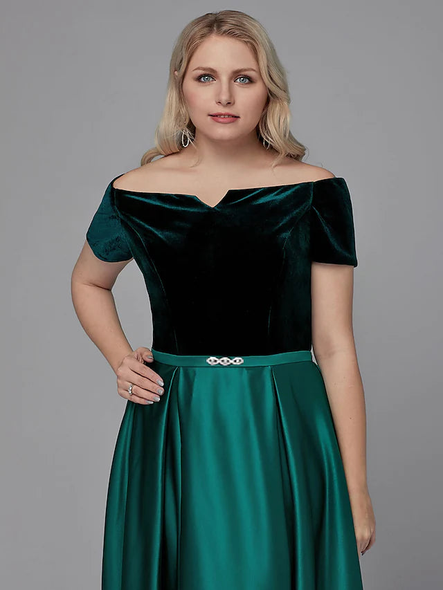 Close-up of the off-shoulder neckline and short sleeve on the satin dress.