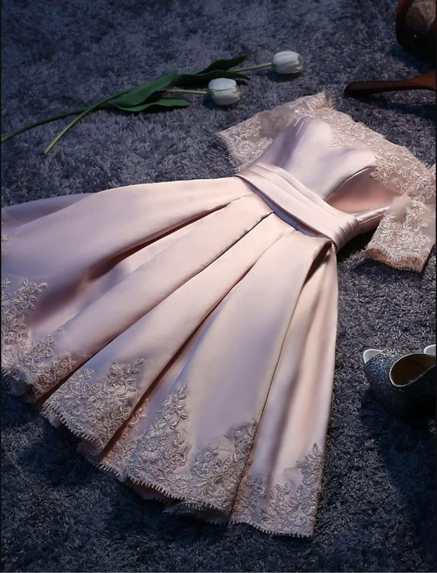 Elegant A-line bridesmaid dress with off-shoulder neckline, short sleeves, satin, and lace details.
