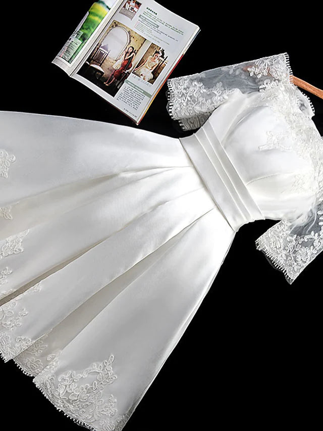 Back view of the off-shoulder A-line mini bridesmaid dress, showcasing its silhouette.