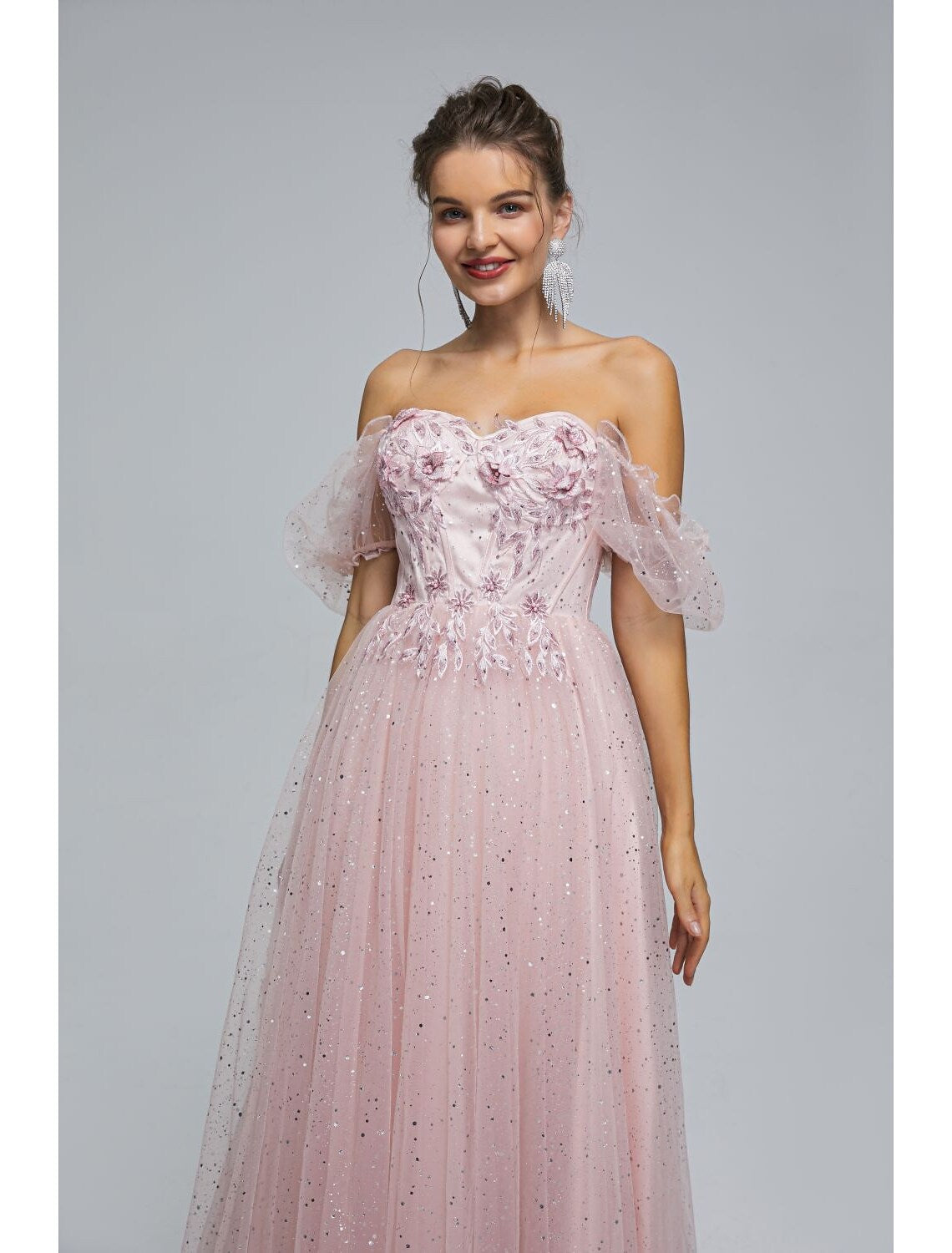 Side view of the princess-style tea length quinceanera dress.