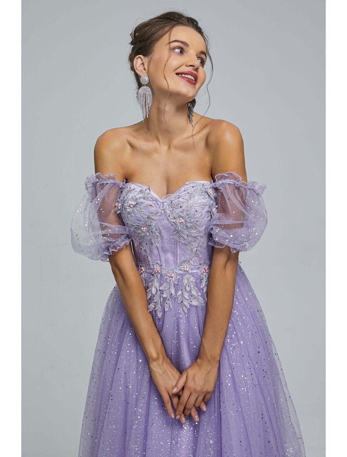 Flowing tulle skirt of the tea length formal dress.